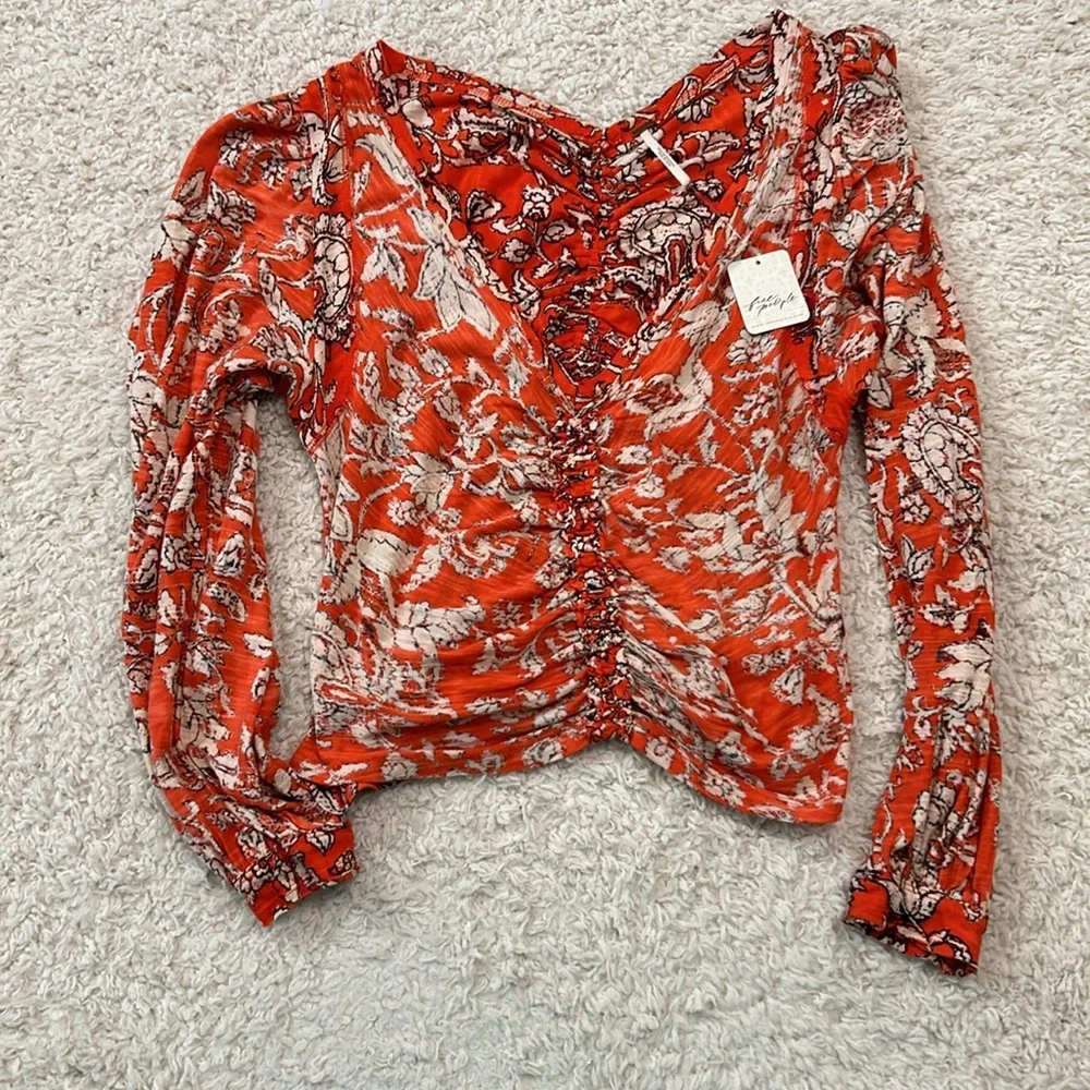 NWT FREE PEOPLE M Say the Word top with balloon sleeves in funky V neck style